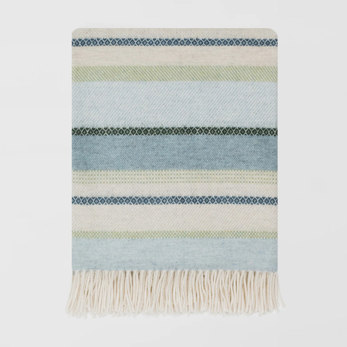A woven merino throw with horizontal stripes in light blue, cream, pale green, and navy, finished with a cream fringe at the bottom, shown against a plain white background.