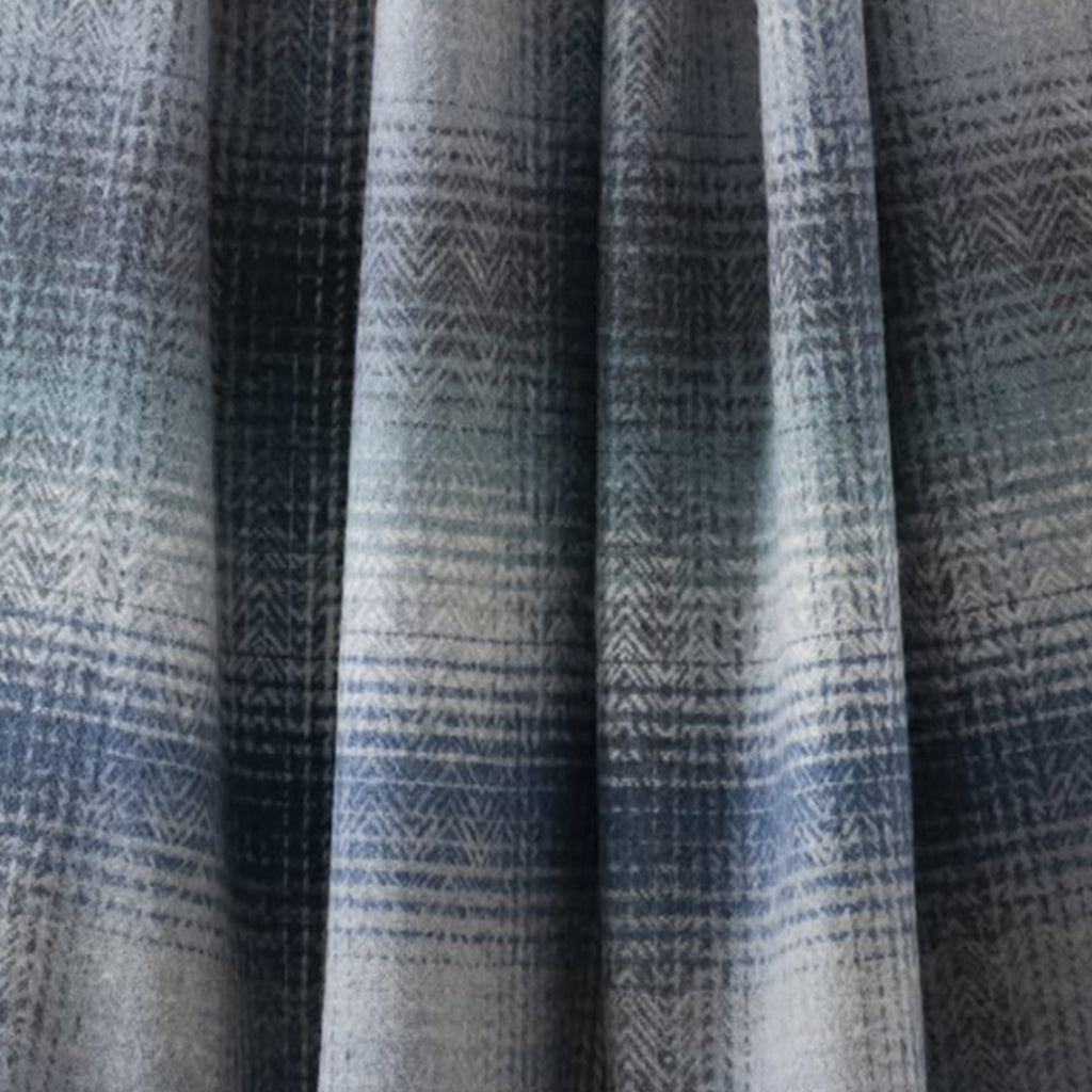 A large blue and white wool blanket or throw close up image.