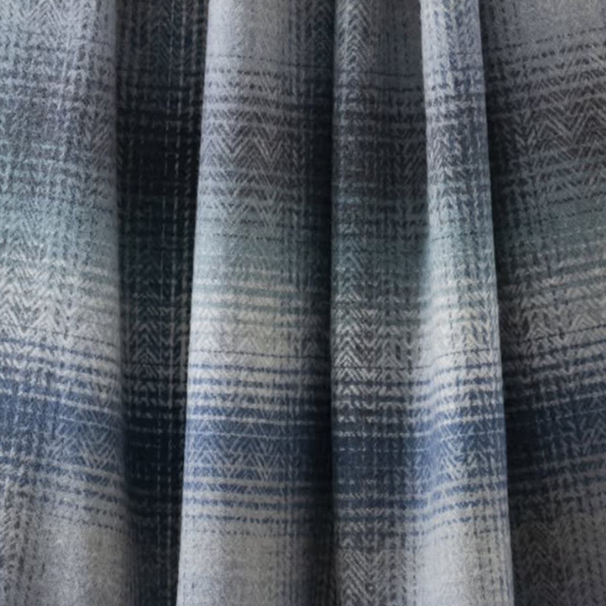 A large blue and white wool blanket or throw close up image.