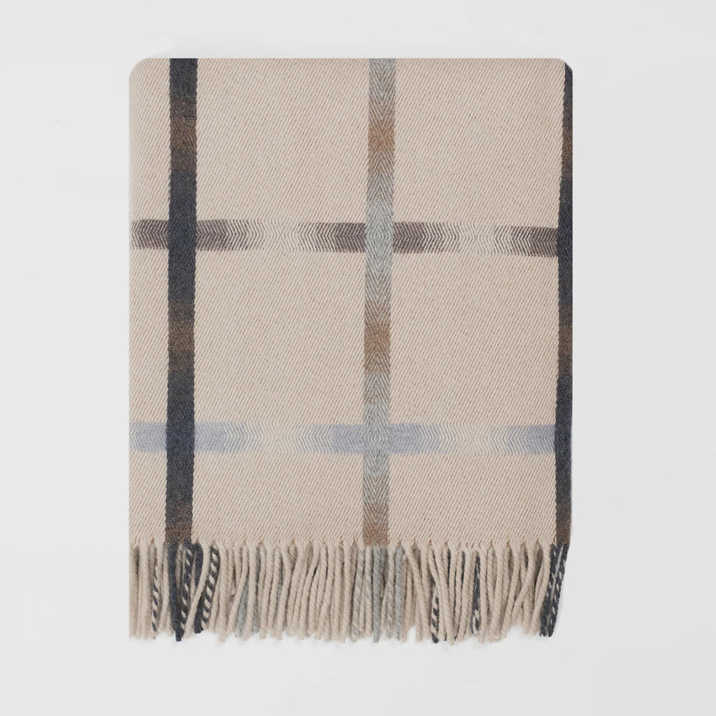 A classic plaid merino Remony blanket in beige, brown, and cream with fringed edges, displayed flat against a light background.