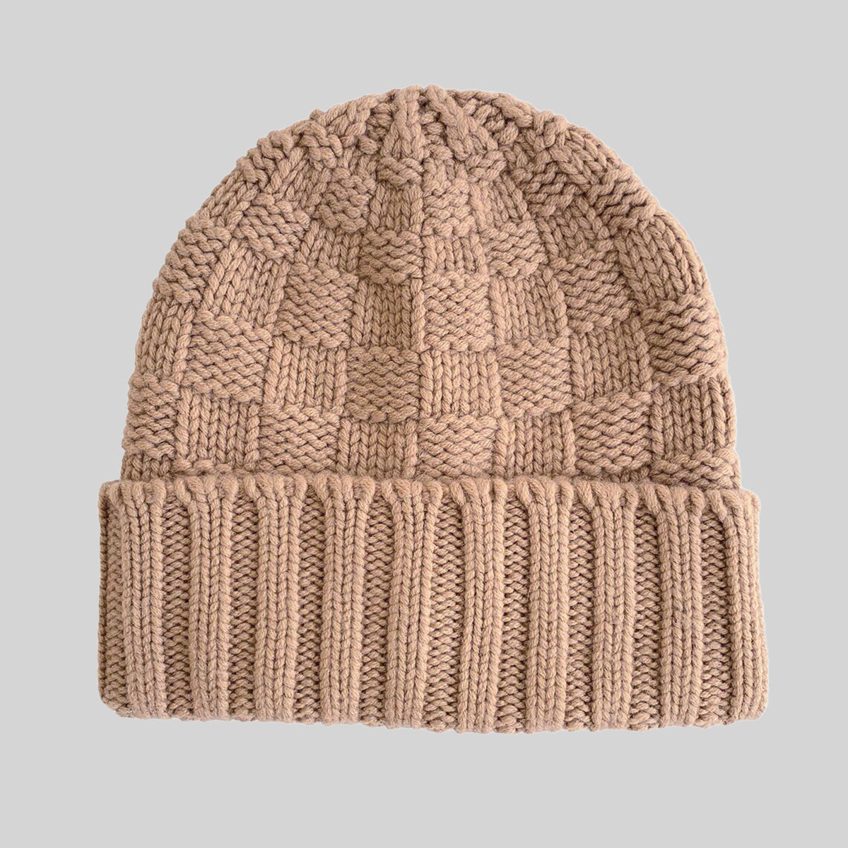 A toffee checkerboard chunky cashmere knit beanie hat with a ribbed cuff, shown against a solid light grey background.